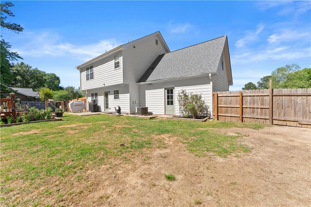 709 Muirfield Drive Winder, GA 30680 - Photo 53 of 65 a front view of a house with a yard