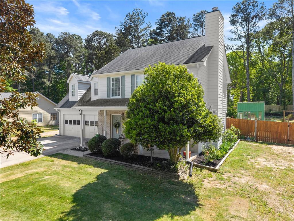 709 Muirfield Drive Winder, GA 30680 - Photo 6 of 65 a view of a house with a yard and sitting area