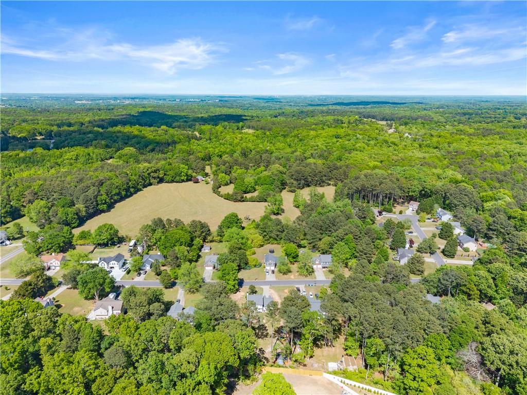 709 Muirfield Drive Winder, GA 30680 - Photo 64 of 65 a view of a lake with a city