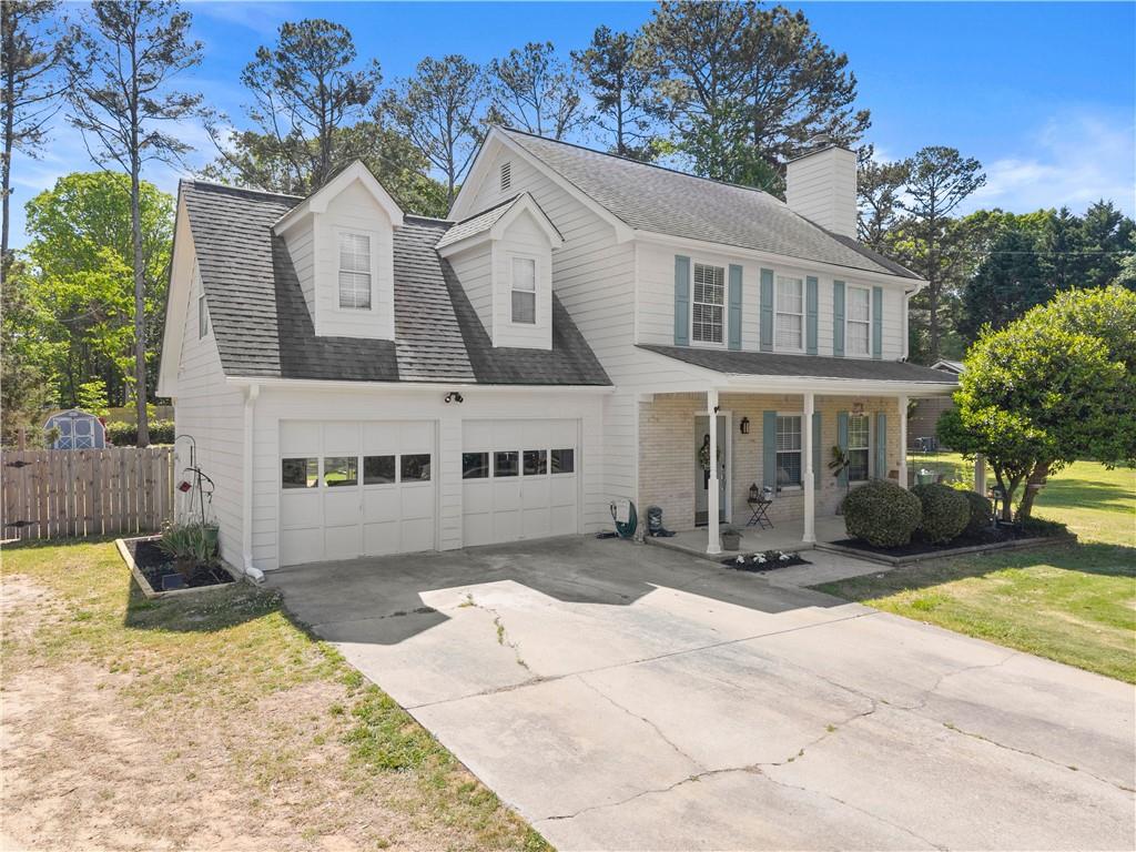 709 Muirfield Drive Winder, GA 30680 - Photo 7 of 65 a view of a white building among the front of a house