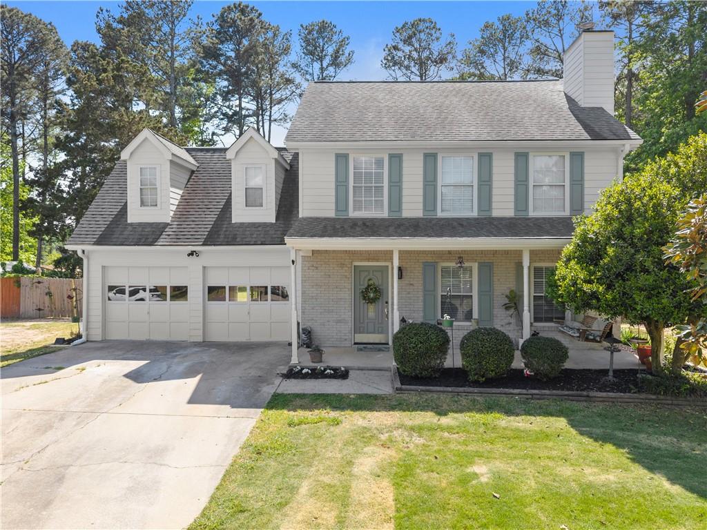 709 Muirfield Drive Winder, GA 30680 - Photo 8 of 65 front view of a house with a swimming pool
