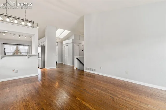 a view of a livingroom with wooden floor