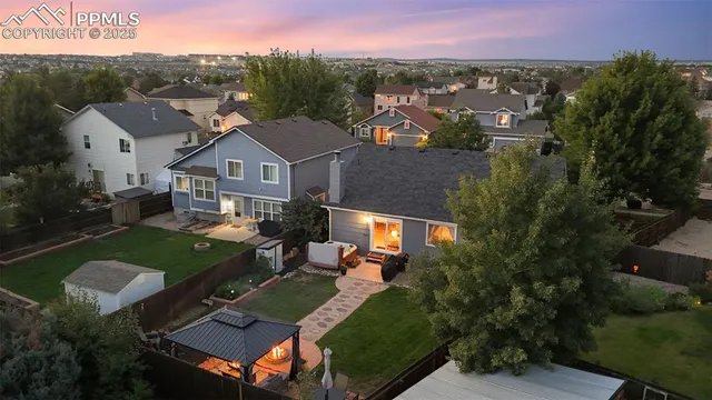 an aerial view of a house with a garden