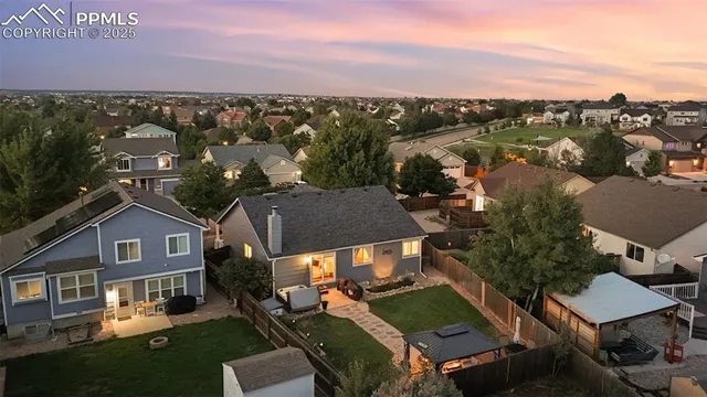 an aerial view of a house with a garden