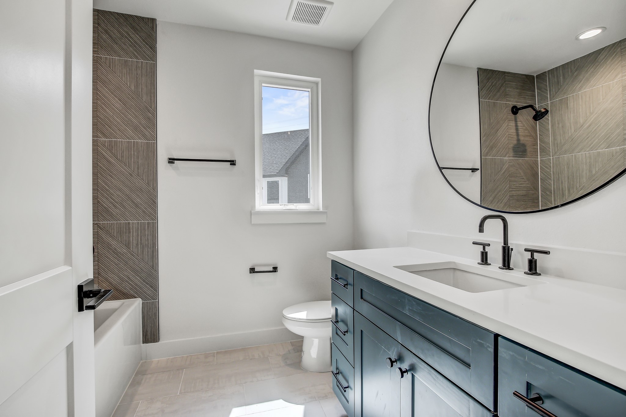 4127 East 12th Street, Unit 1 Austin, TX 78721 - Photo 22 of 30 a bathroom with a sink toilet and a mirror