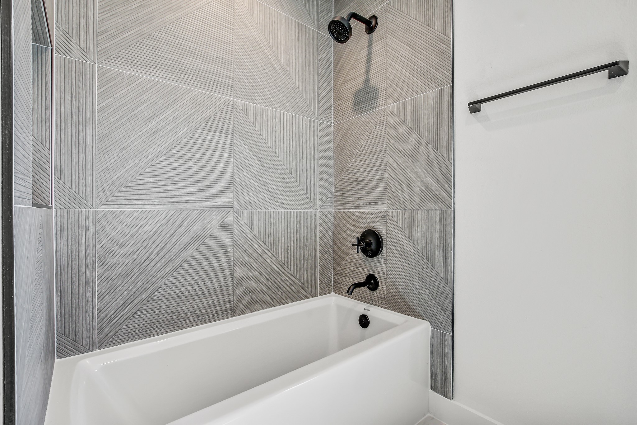 4127 East 12th Street, Unit 1 Austin, TX 78721 - Photo 23 of 30 a bathroom with a bathtub