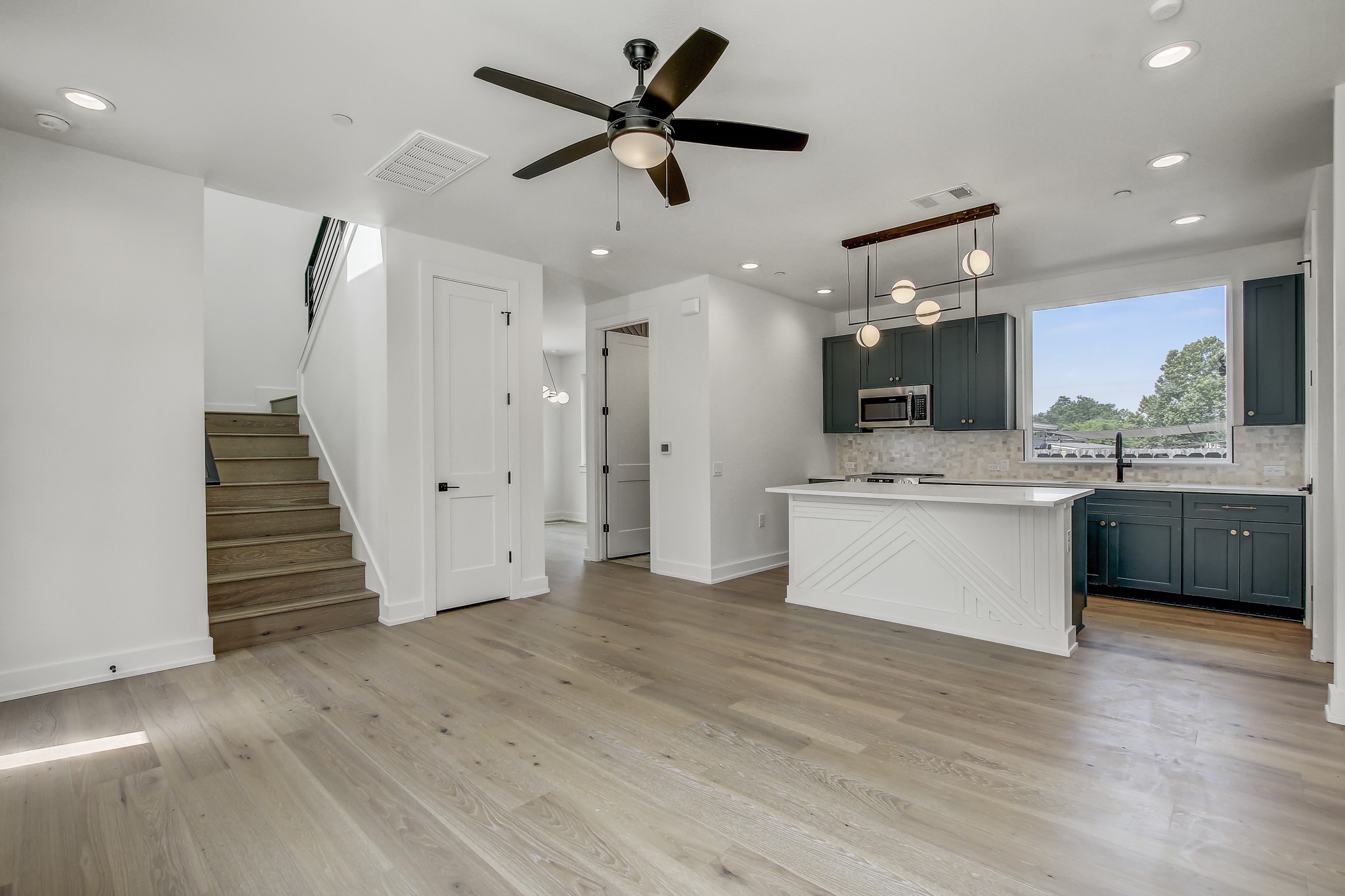 4127 East 12th Street, Unit 1 Austin, TX 78721 - Photo 6 of 30 a view of a kitchen with a sink and a large window