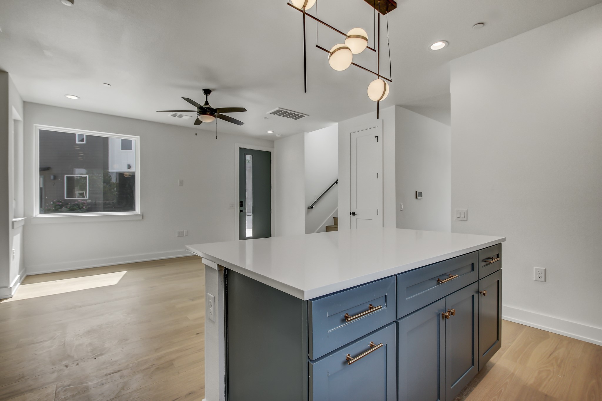 4127 East 12th Street, Unit 1 Austin, TX 78721 - Photo 9 of 30 a kitchen with a sink dishwasher and a refrigerator with wooden floor