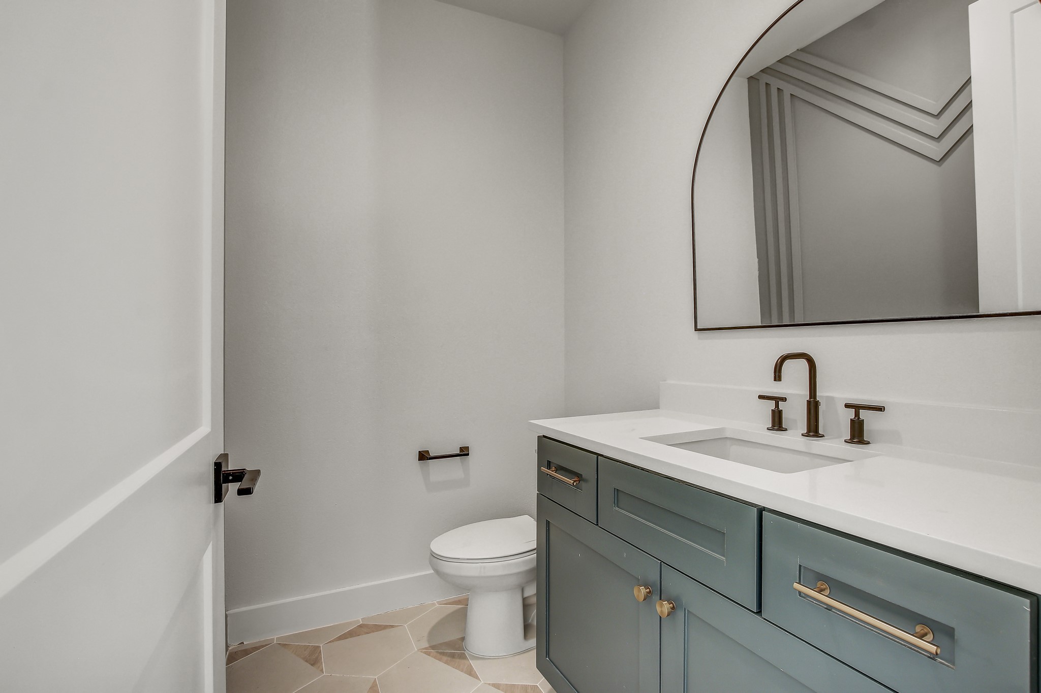 4127 East 12th Street, Unit 1 Austin, TX 78721 - Photo 10 of 30 a bathroom with a granite countertop sink toilet and mirror