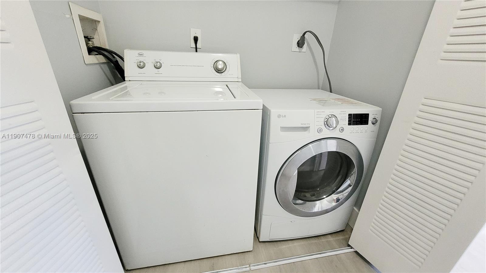 12124 St Andrews Place, Unit 203 Miramar, FL 33025 - Photo 16 of 29 a utility room with dryer and washer