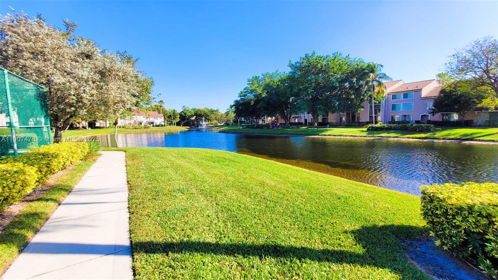 12124 St Andrews Place, Unit 203 Miramar, FL 33025 - Photo 19 of 29 a view of swimming pool from a lake view