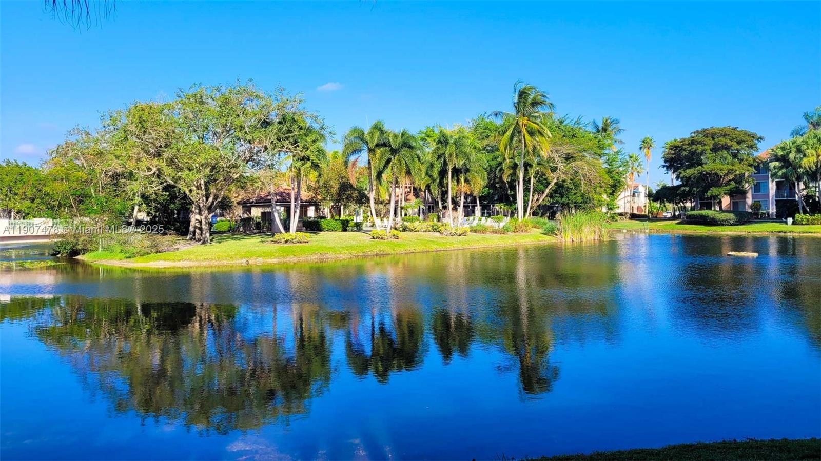 12124 St Andrews Place, Unit 203 Miramar, FL 33025 - Photo 20 of 29 a view of swimming pool with yard