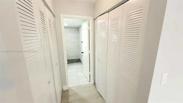 a view of a bathroom from a hallway
