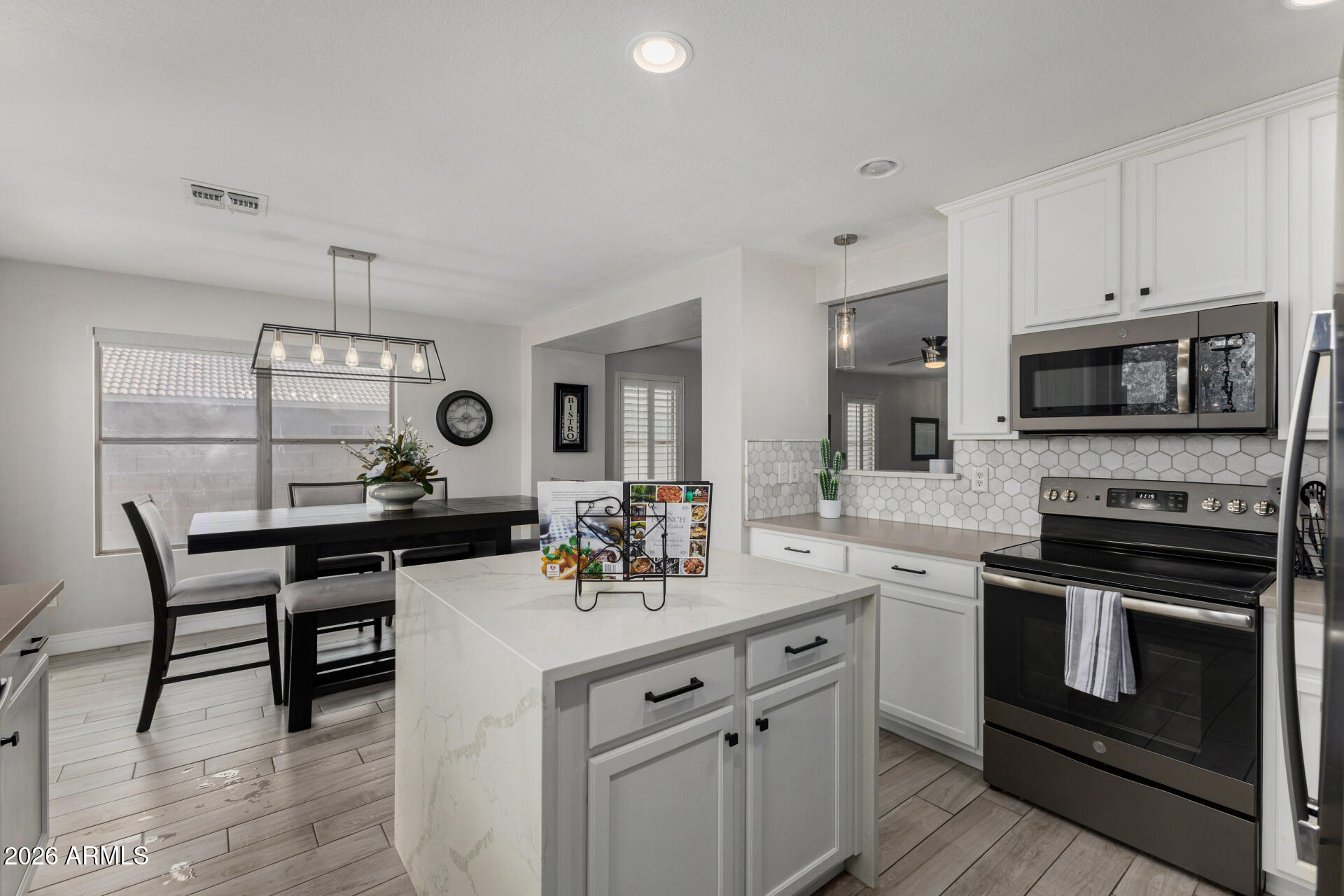 1022 East Pedro Road Phoenix, AZ 85042 - Photo 11 of 29 a kitchen with a sink stove and microwave