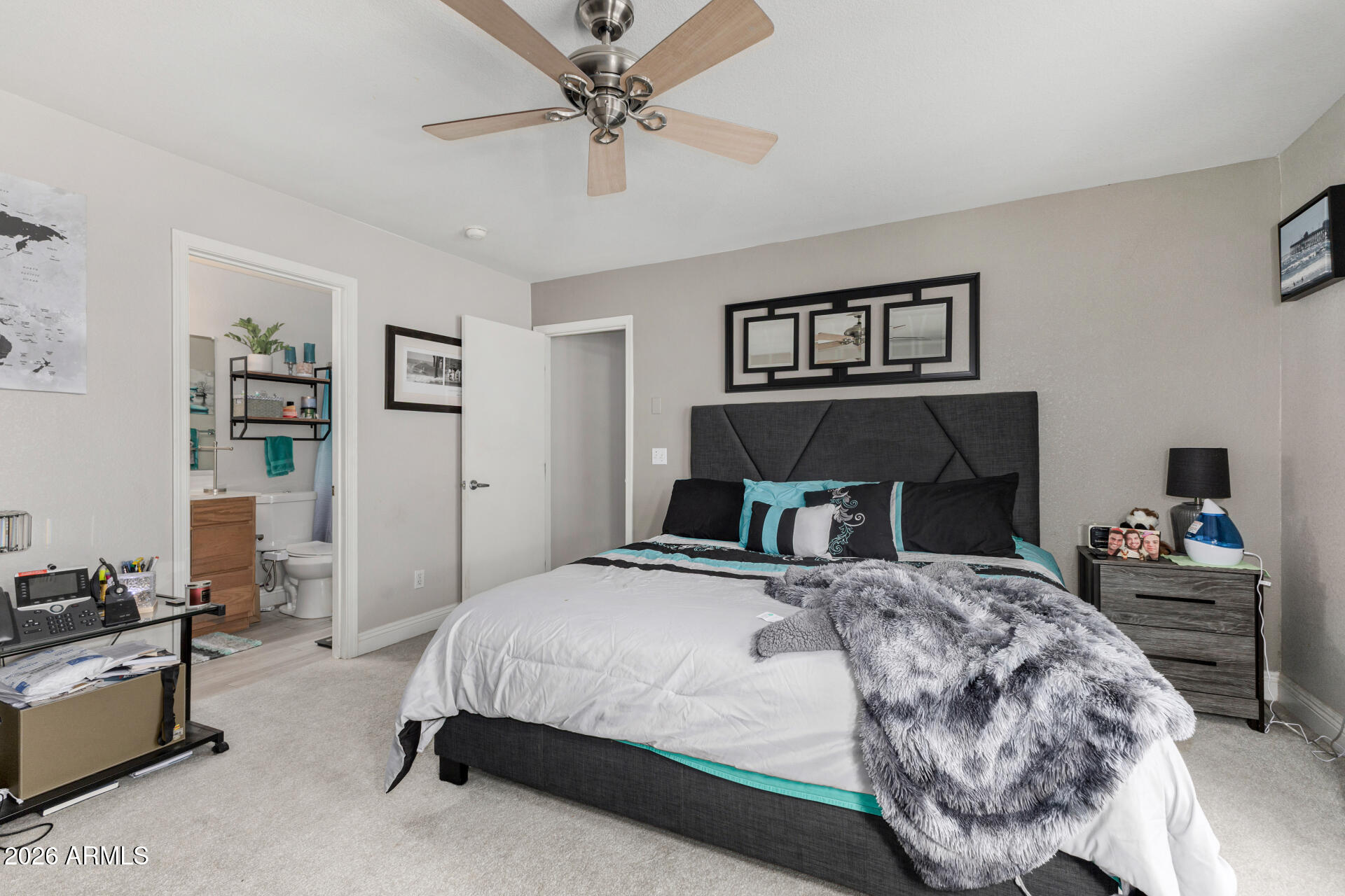 1022 East Pedro Road Phoenix, AZ 85042 - Photo 16 of 29 a bedroom with a bed and dresser