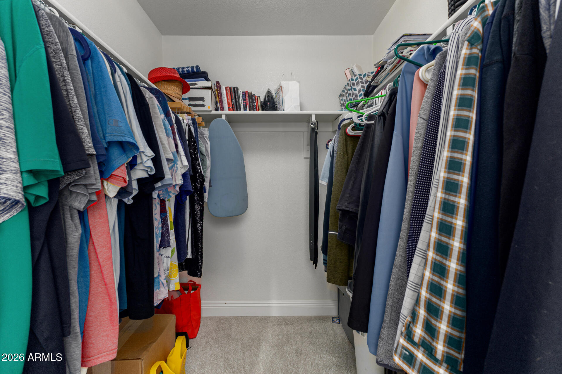 1022 East Pedro Road Phoenix, AZ 85042 - Photo 18 of 29 a view of walk in closet with clothes and shoes