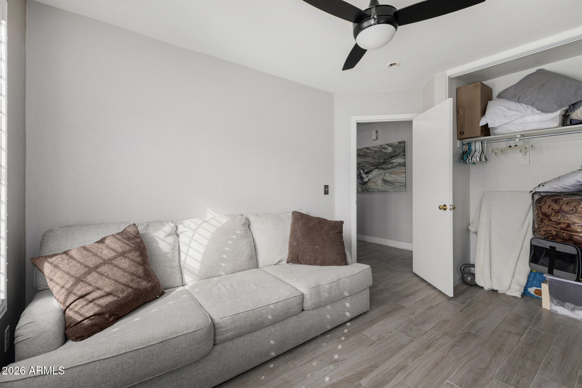 1022 East Pedro Road Phoenix, AZ 85042 - Photo 22 of 29 a living room with furniture and a ceiling fan