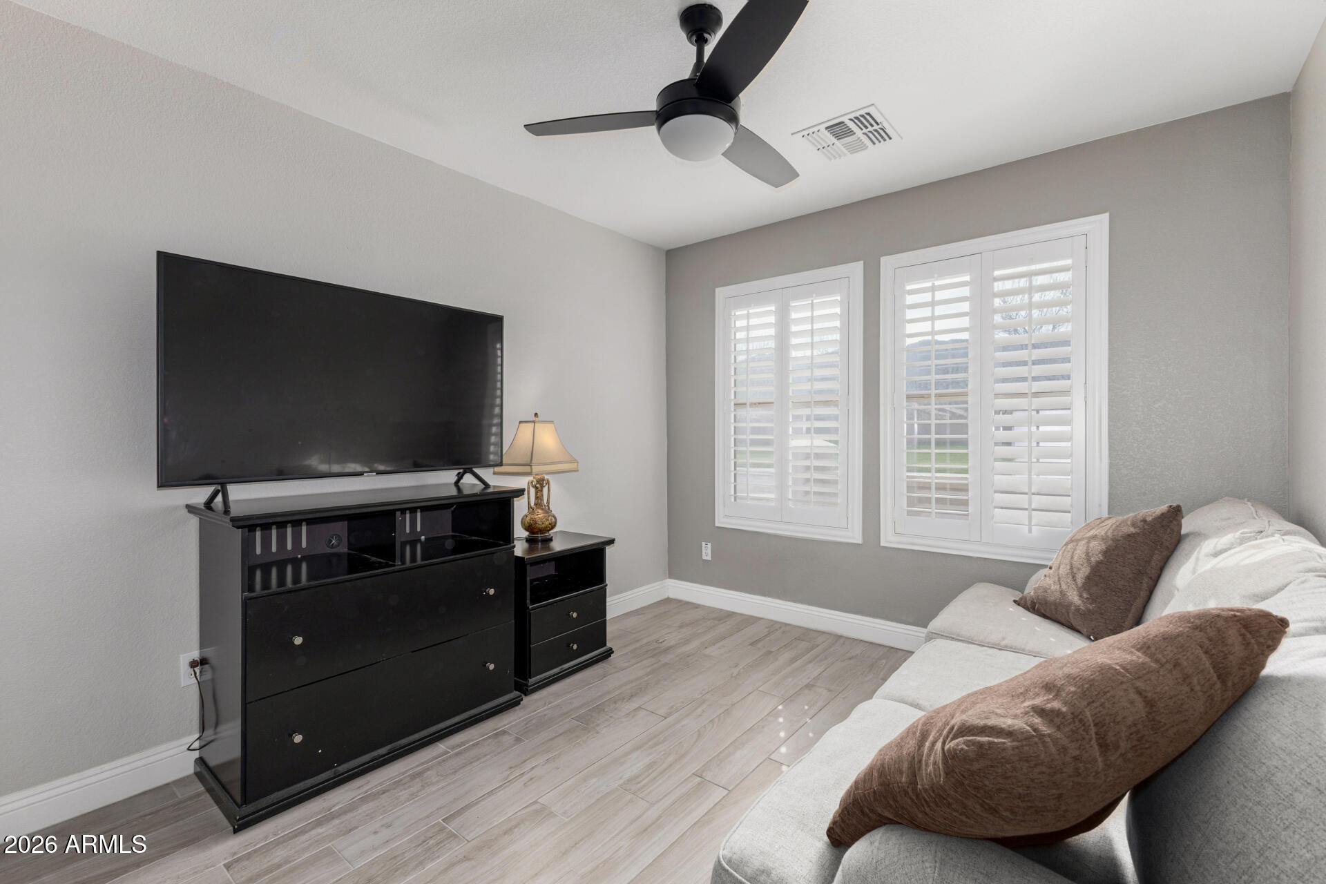 1022 East Pedro Road Phoenix, AZ 85042 - Photo 23 of 29 a living room with furniture and a flat screen tv
