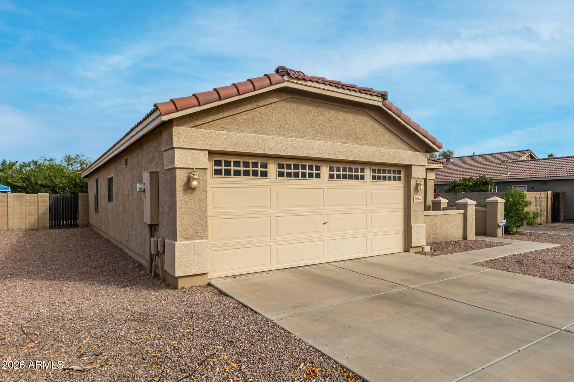 1022 East Pedro Road Phoenix, AZ 85042 - Photo 3 of 29 a view of a house with a garage
