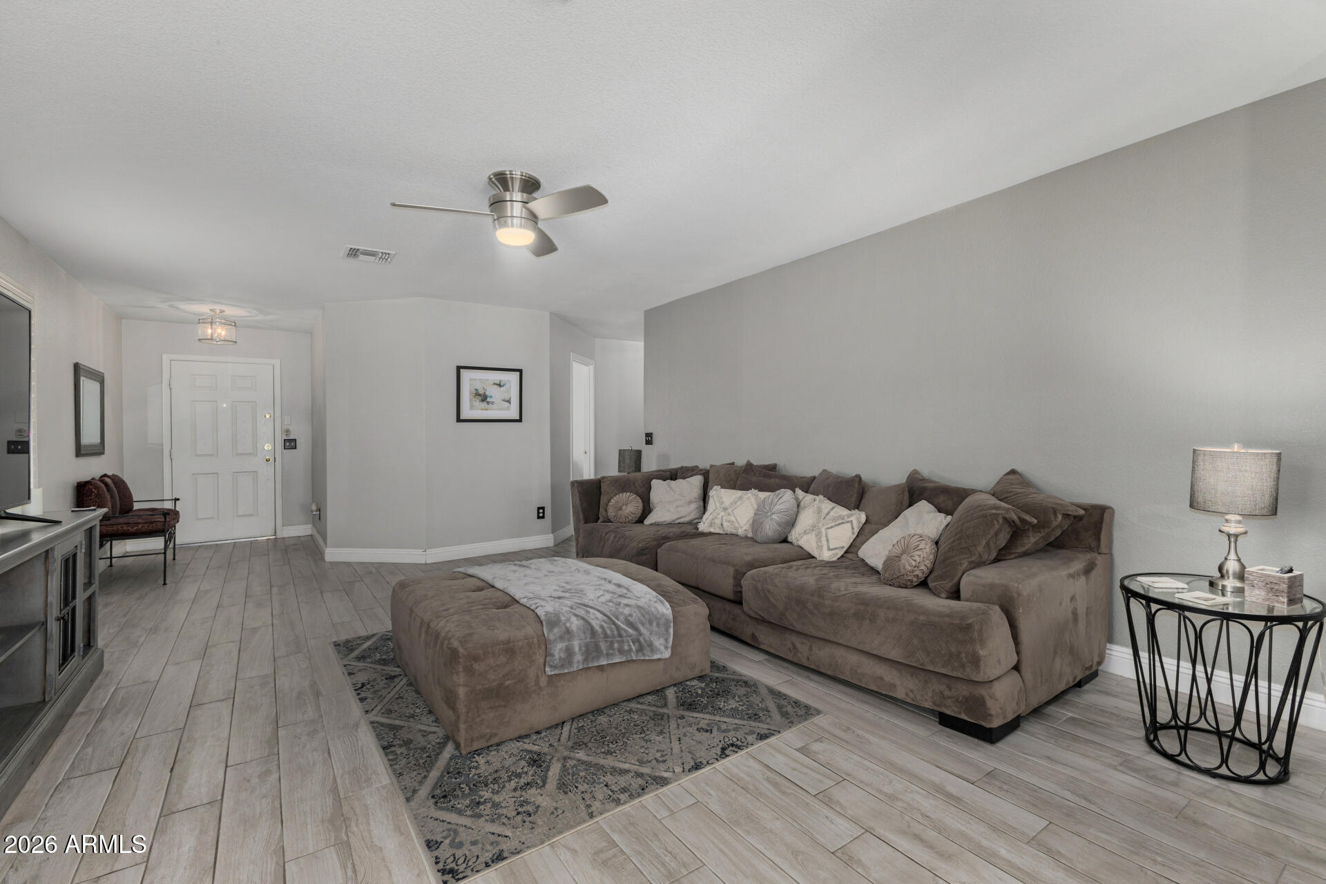 1022 East Pedro Road Phoenix, AZ 85042 - Photo 7 of 29 a living room with furniture and a wooden floor