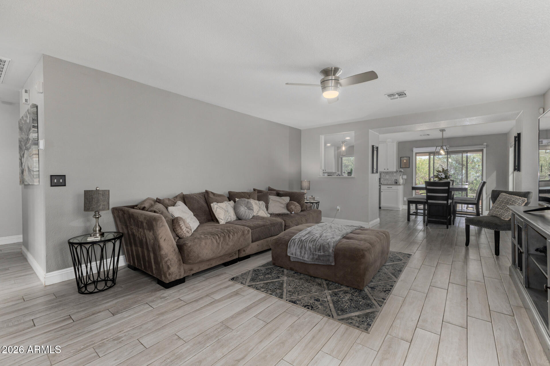 1022 East Pedro Road Phoenix, AZ 85042 - Photo 8 of 29 a living room with furniture and a wooden floor