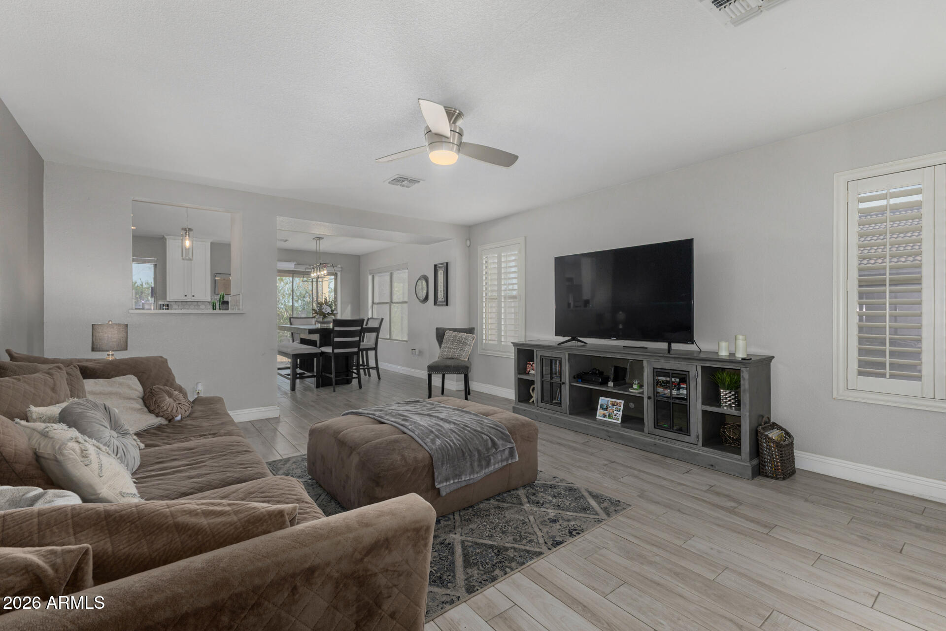 1022 East Pedro Road Phoenix, AZ 85042 - Photo 9 of 29 a living room with furniture and a flat screen tv