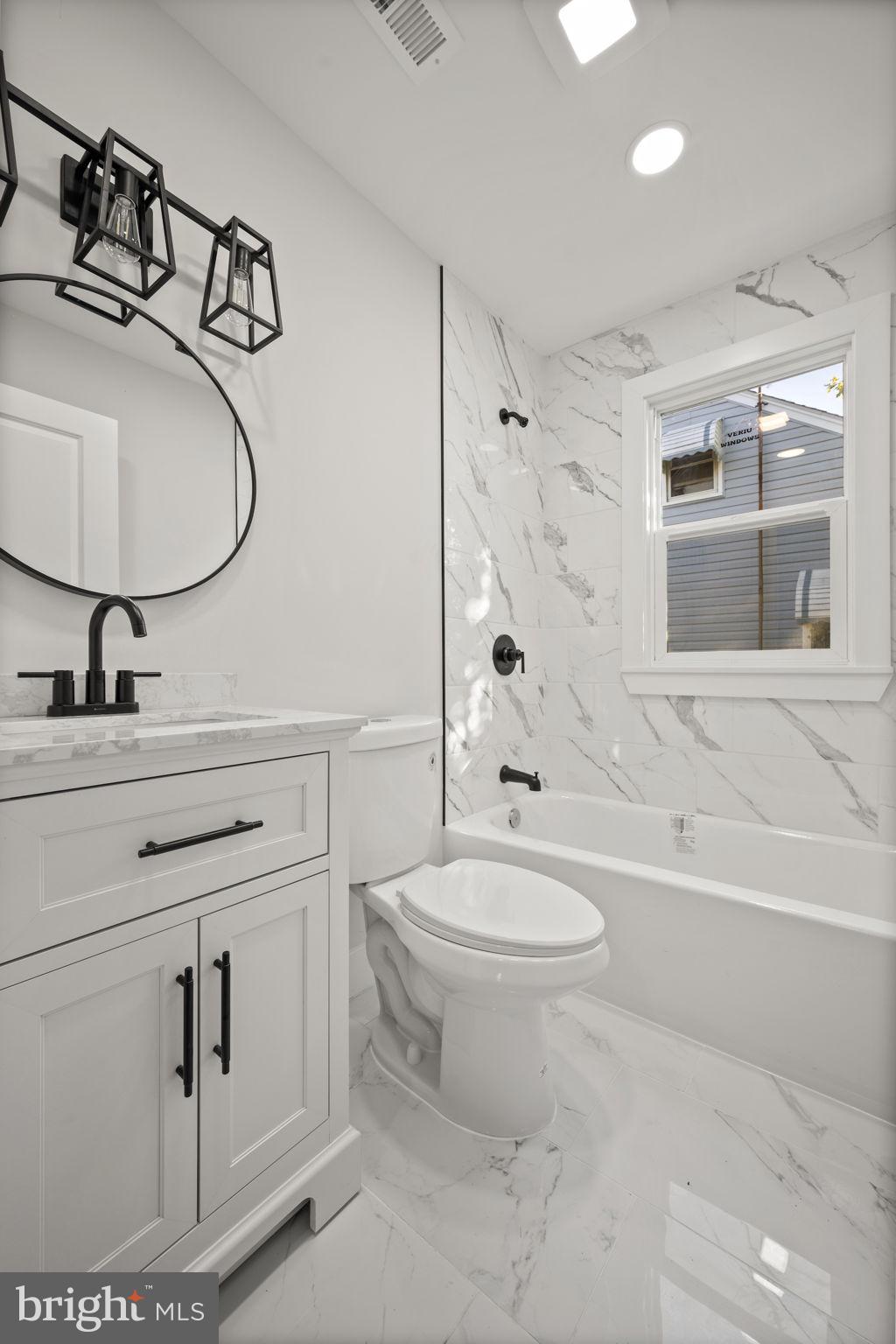 821 South Woodlynn Road Baltimore, MD 21221 - Photo 13 of 32 a bathroom with a toilet sink and mirror