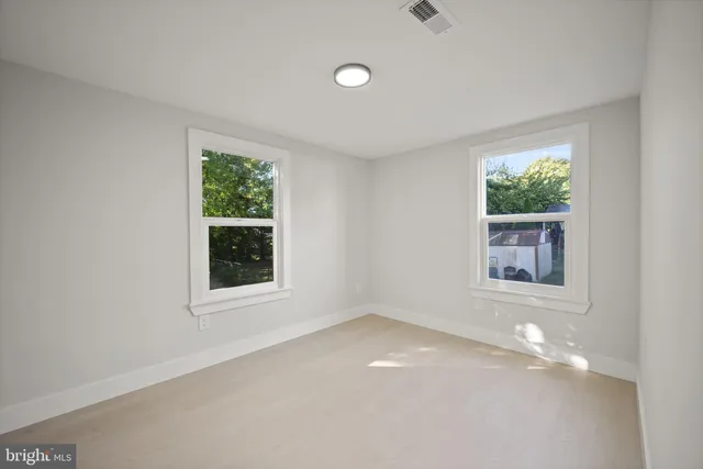 an empty room with windows