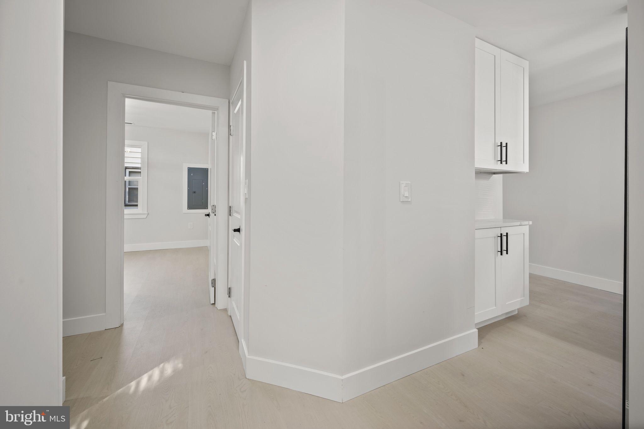 821 South Woodlynn Road Baltimore, MD 21221 - Photo 19 of 32 a view of a hallway with white walls