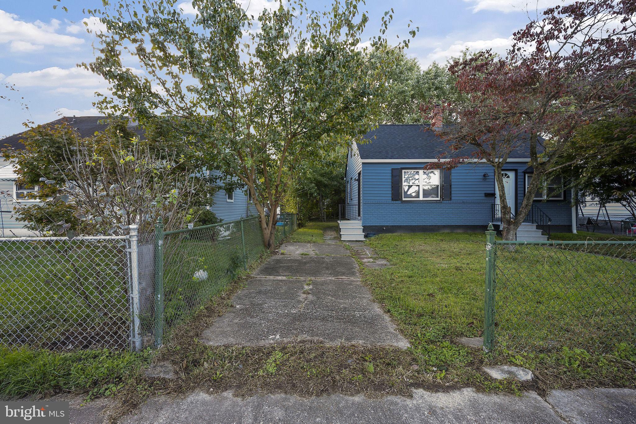 821 South Woodlynn Road Baltimore, MD 21221 - Photo 30 of 32 a view of a house with a yard