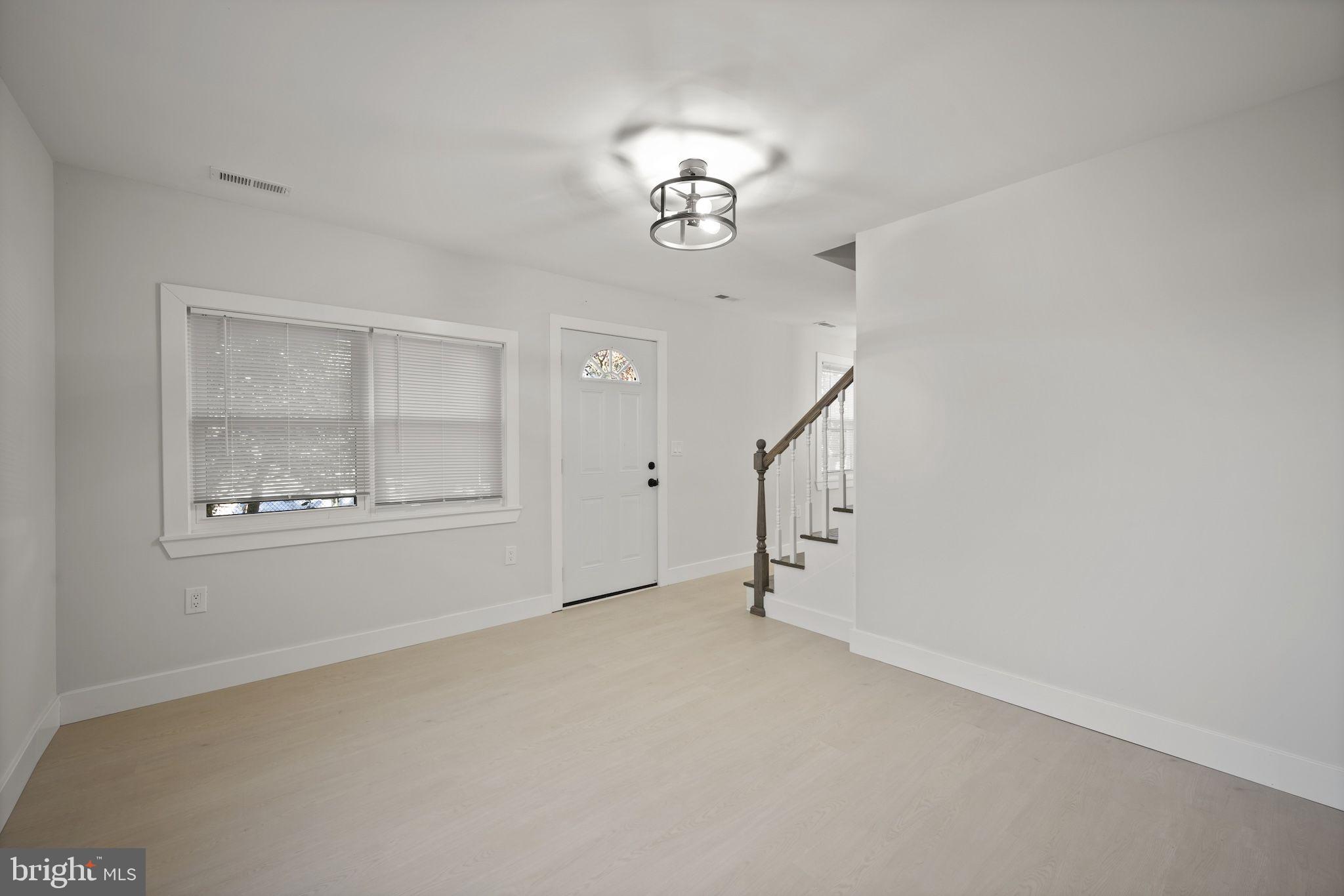 821 South Woodlynn Road Baltimore, MD 21221 - Photo 5 of 32 a view of an empty room with a window