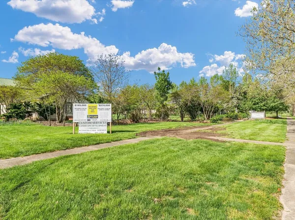 a view of a house with a big yard