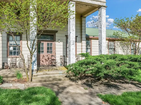 front view of a house with a yard