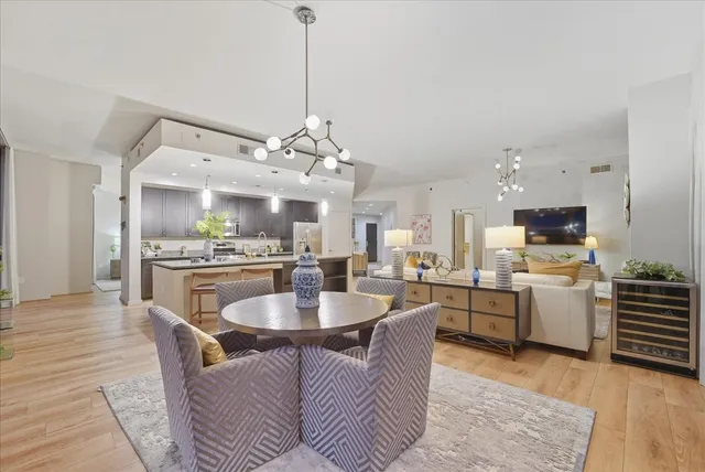 a large kitchen with a table and chairs