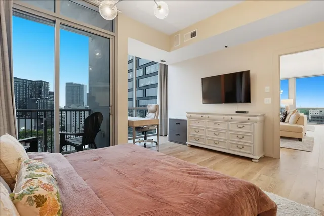 a view of a bedroom with furniture and window