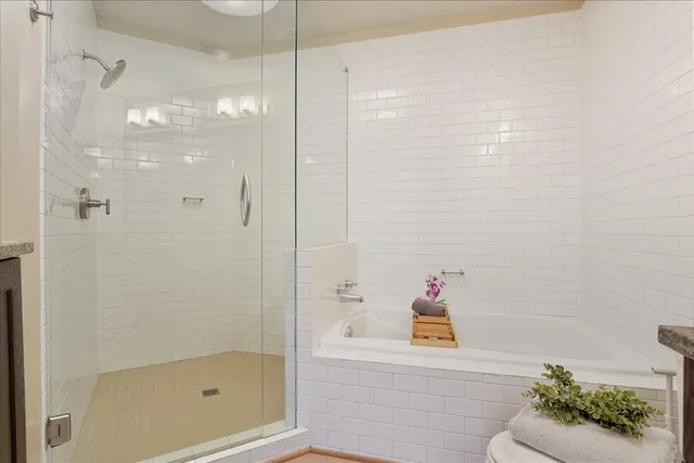a bathroom with a shower and a shower