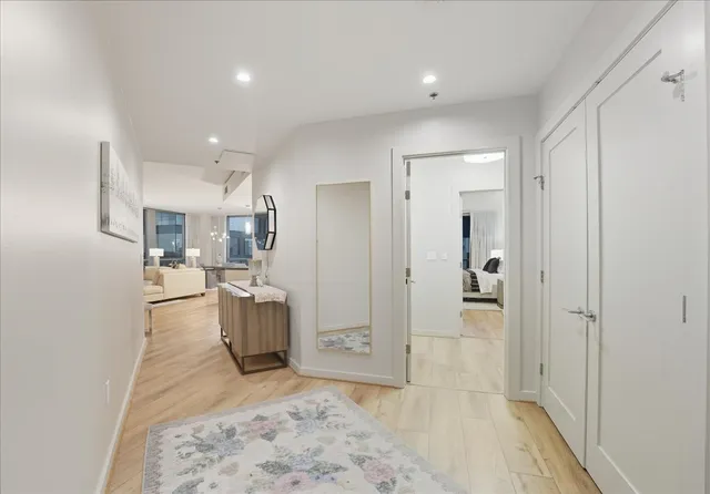 a view of a kitchen and a refrigerator in a kitchen