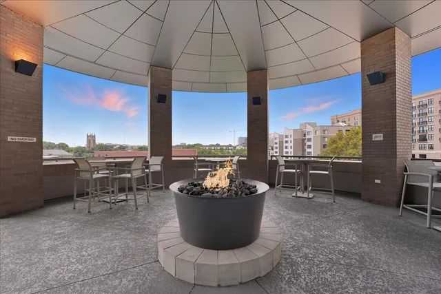 a view of a terrace with furniture and a backyard
