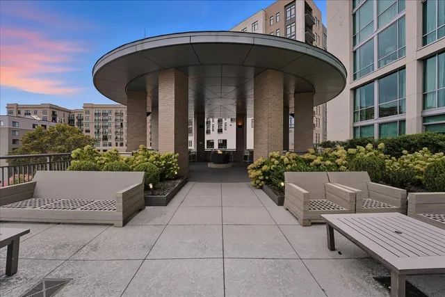 a view of a building with potted plants