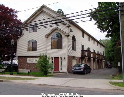 120 West Main Street, Unit B5 Meriden, CT 06451 - Photo 1 of 1 a car parked in front of a white house