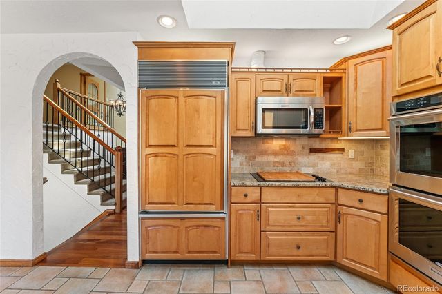 a kitchen with appliances cabinets and a sink