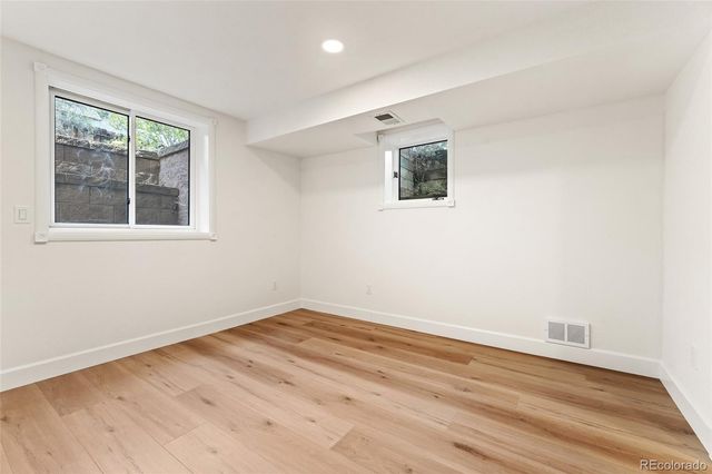 a bathroom with a sink vanity and mirror
