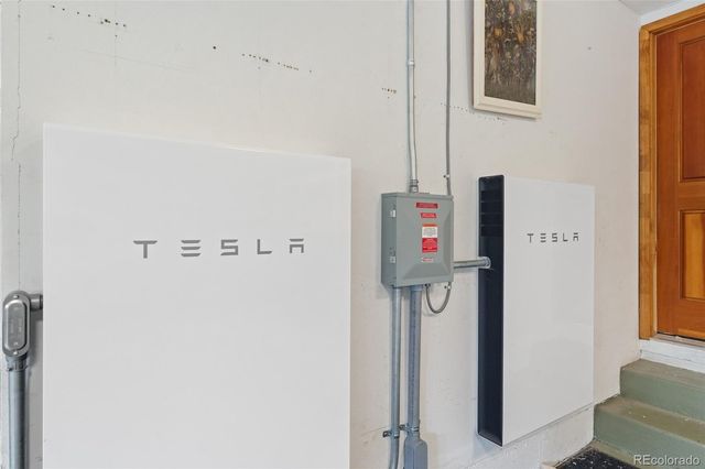 a view of a deck with chairs and wooden floor