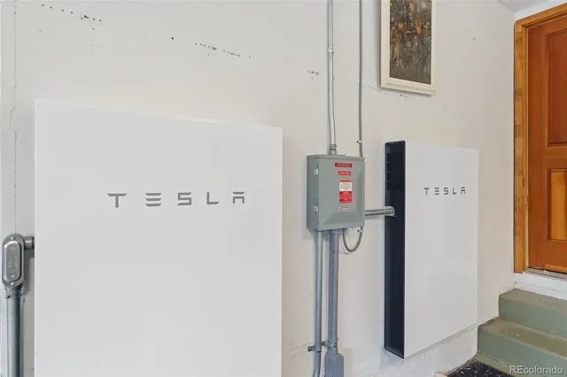 a view of a deck with chairs and wooden floor