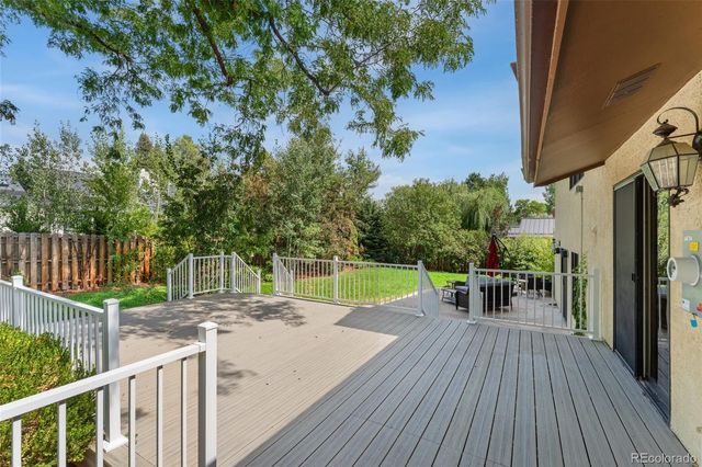 a view of a house with backyard porch and sitting area