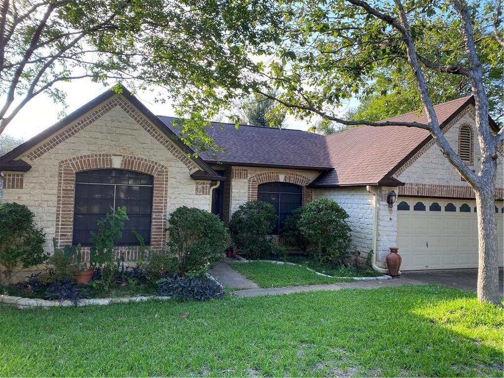 8007 Bounty Trail Austin, TX 78749 - Photo 2 of 32 A charming brick and stone facade welcomes you to this delightful home with an attached garage.