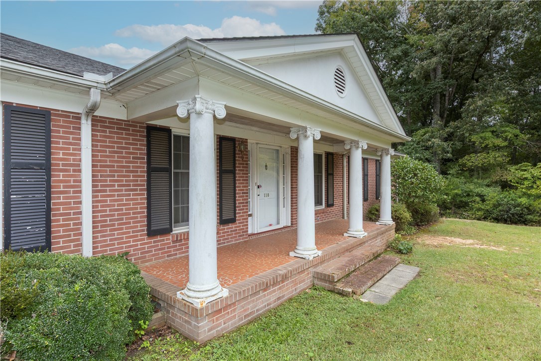 118 Blair Road Belton, SC 29627 - Photo 4 of 49 Stately white columns line a classic brick porch welcoming visitors to this elegant residence.