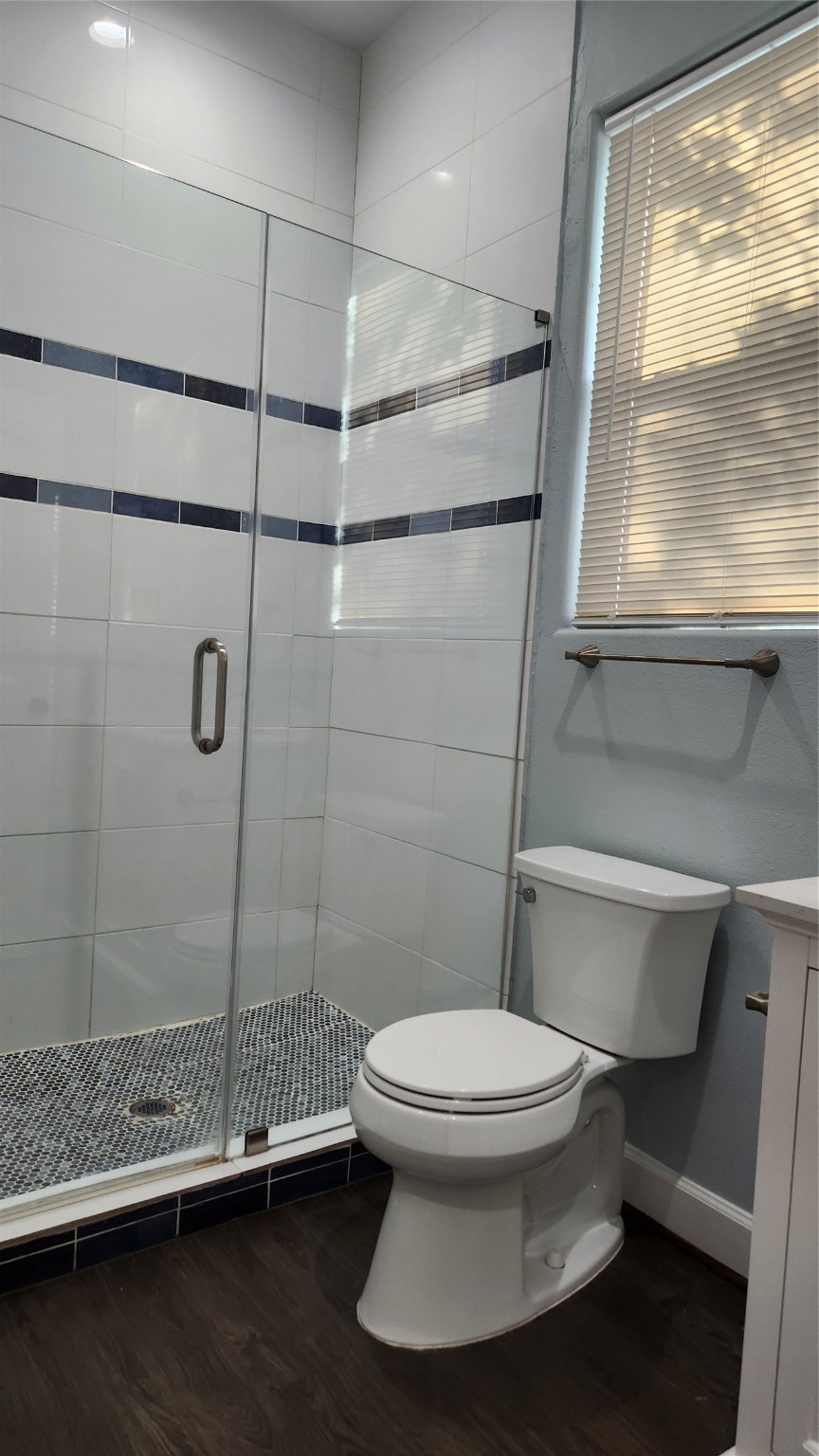 7828 Pardee Street Houston, TX 77028 - Photo 12 of 18 a bathroom with a toilet and a shower