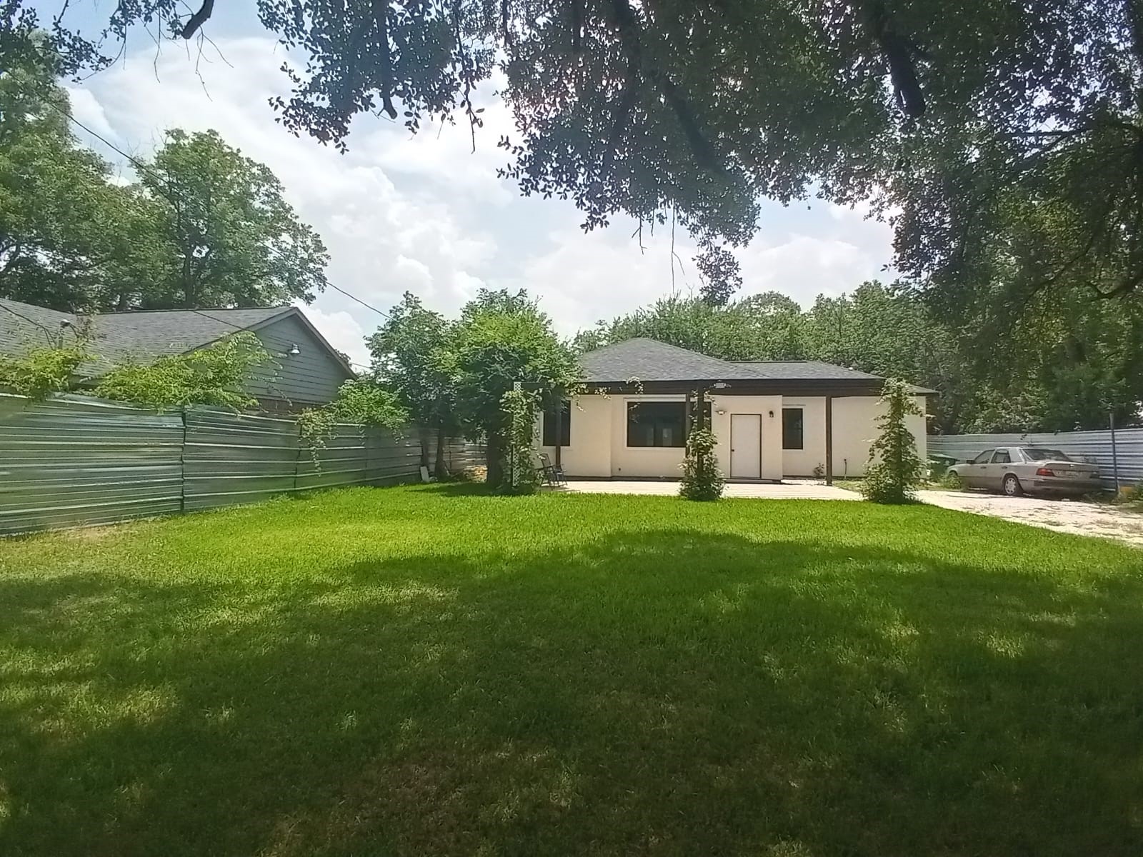 7828 Pardee Street Houston, TX 77028 - Photo 17 of 18 a front view of a house with a garden