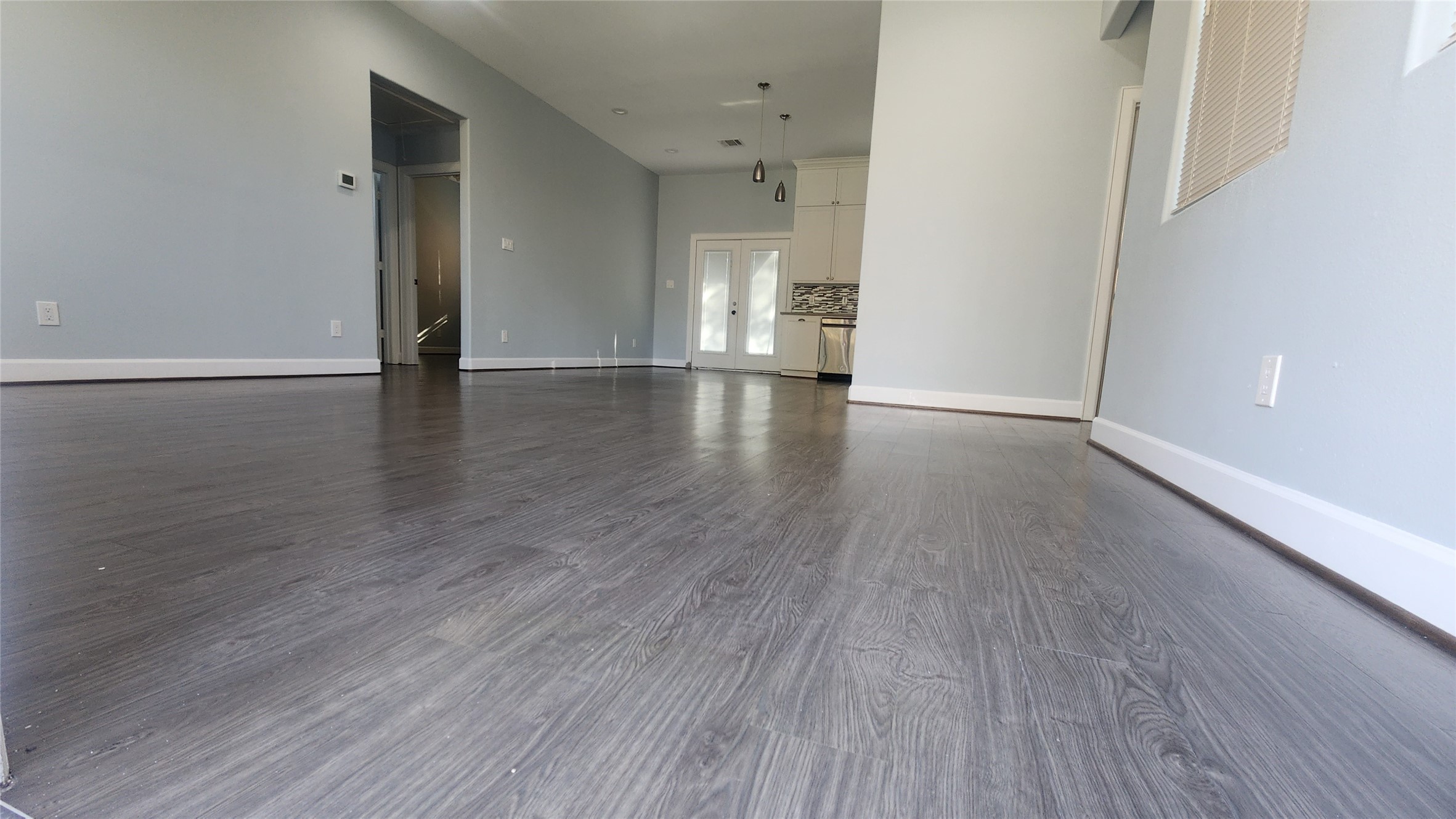 7828 Pardee Street Houston, TX 77028 - Photo 5 of 18 wooden floor in an empty room with a window